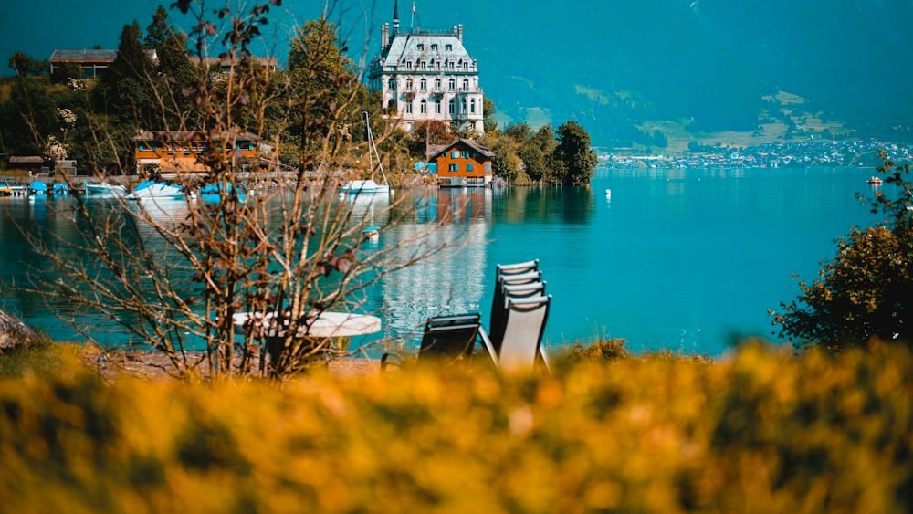 Scenic Swiss lake surrounded by green Alps, a top nature destination to visit in June